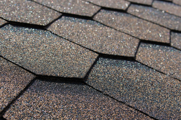 Roofing crew installing a new complete roof assembly